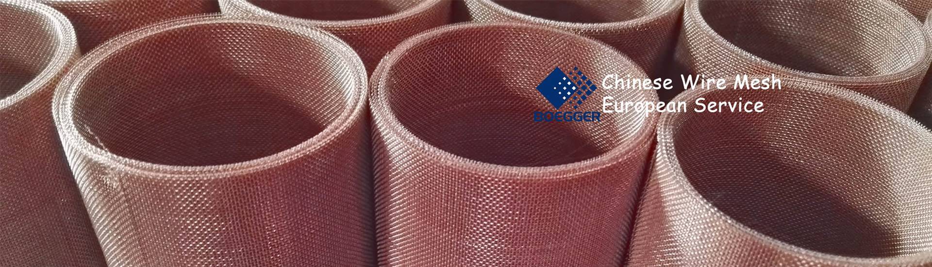 There are several rolls of coarse copper mesh gathering together, the structure is even and surface is bright.